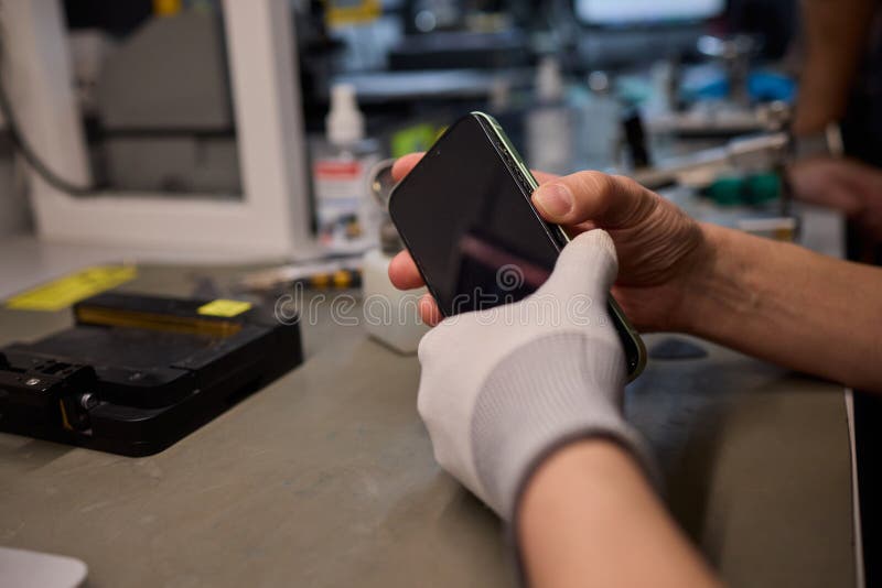 Expert Smartphone Repair Using Advanced Precision Tools for Optimal Performance and Quality royalty free stock image