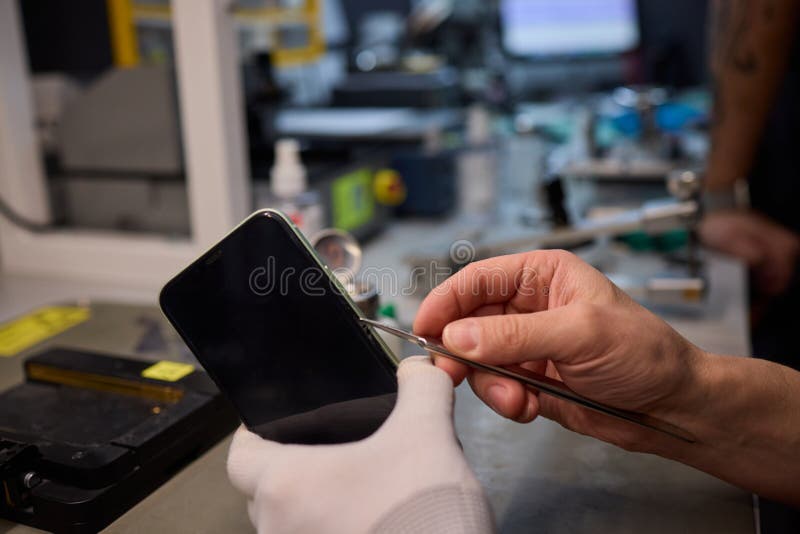 Expert Smartphone Repair Using Advanced Precision Tools for Optimal Performance and Quality stock image