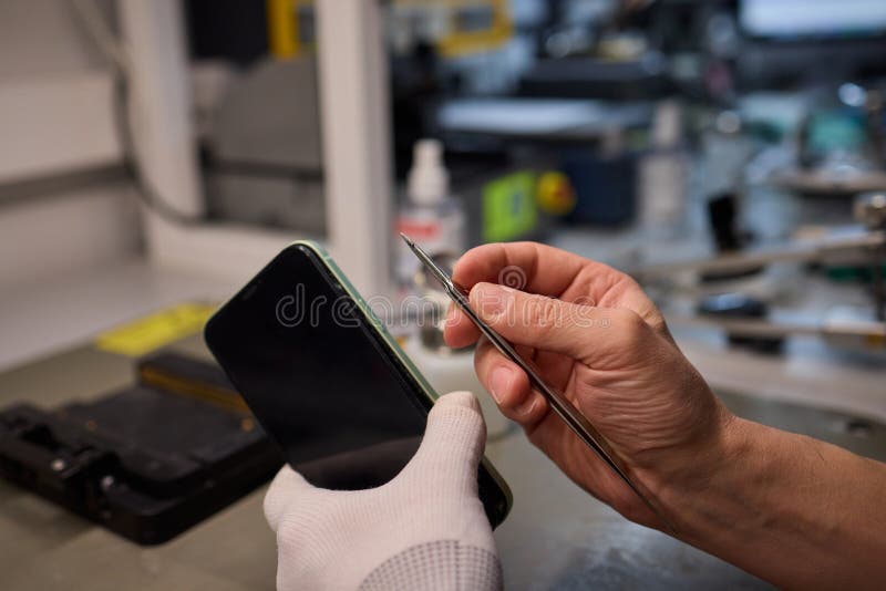 Expert Smartphone Repair Using Advanced Precision Tools for Optimal Performance and Quality royalty free stock photography