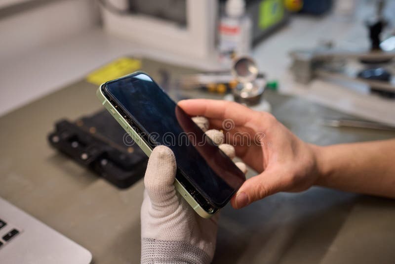 Expert Smartphone Repair Using Advanced Precision Tools for Optimal Performance and Quality royalty free stock photo