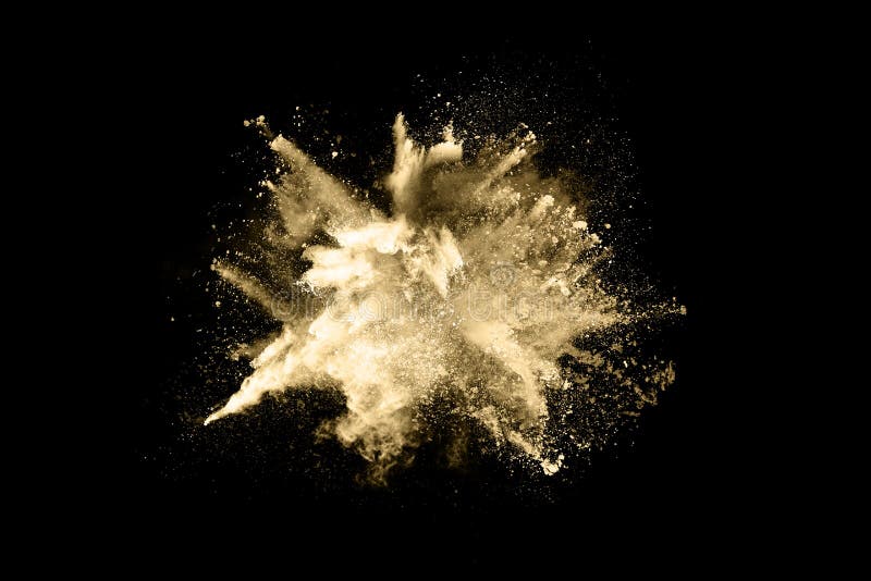 Explosion av guldpulver arkivfoton
