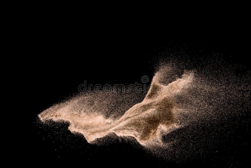 Dry river sand explosion. Golden colored sand splash against dark background. Dry river sand explosion. Golden colored sand splash against dark background.