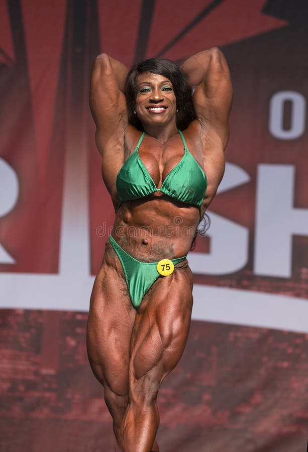 Female Figure Model Flexes Her Muscles and Shows Her Physique