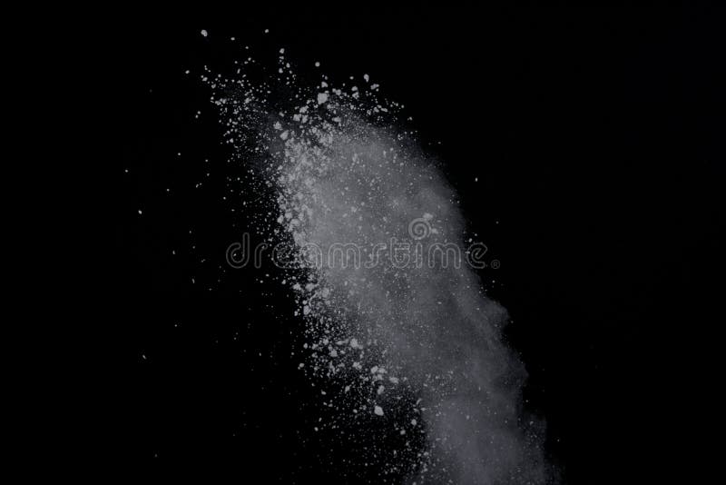 White powder explosion on black background. Dust splatted isolated. Paint Holi. White powder explosion on black background. Dust splatted isolated. Paint Holi.