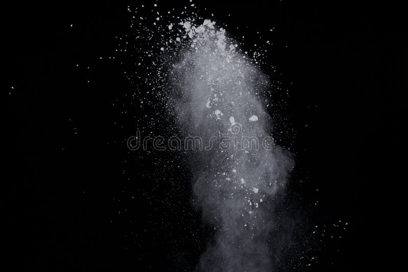 White powder explosion on black background. Dust splatted isolated. Paint Holi. White powder explosion on black background. Dust splatted isolated. Paint Holi.