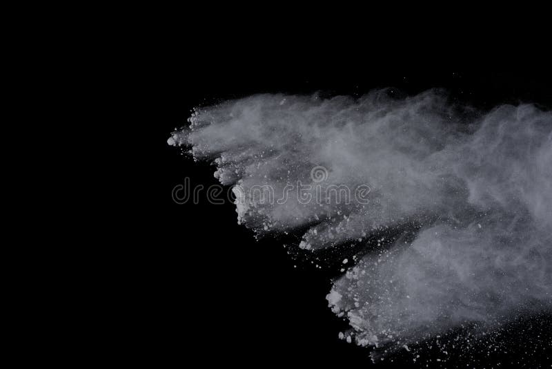 White powder explosion on black background. Dust splatted isolated. Paint Holi. White powder explosion on black background. Dust splatted isolated. Paint Holi.