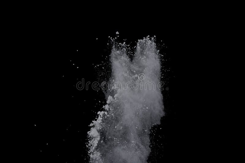 White powder explosion on black background. Dust splatted isolated. Paint Holi. White powder explosion on black background. Dust splatted isolated. Paint Holi.