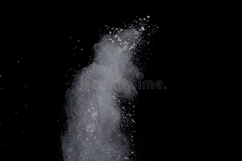 White powder explosion on black background. Dust splatted isolated. Paint Holi. White powder explosion on black background. Dust splatted isolated. Paint Holi.