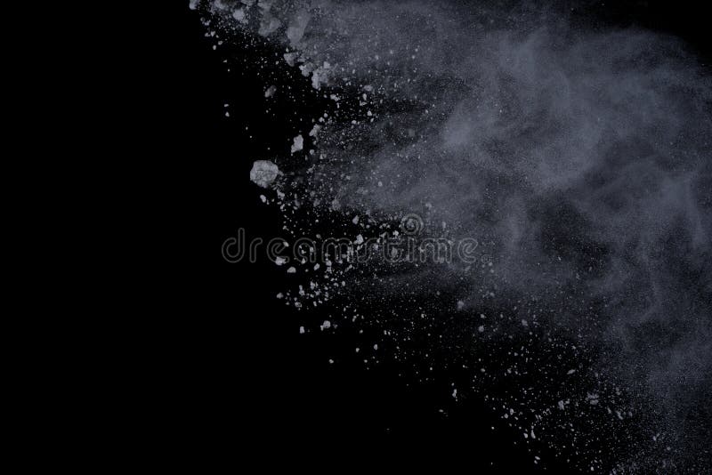 White powder explosion on black background. Dust splatted isolated. Paint Holi. White powder explosion on black background. Dust splatted isolated. Paint Holi.