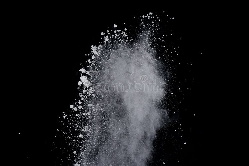 White powder explosion on black background. Dust splatted isolated. Paint Holi. White powder explosion on black background. Dust splatted isolated. Paint Holi.