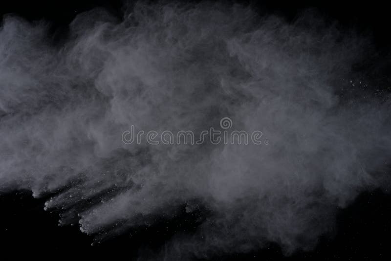 White powder explosion on black background. Dust splatted isolated. Paint Holi. White powder explosion on black background. Dust splatted isolated. Paint Holi.