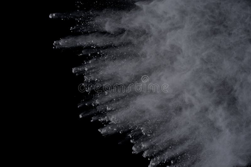 White powder explosion on black background. Dust splatted isolated. Paint Holi. White powder explosion on black background. Dust splatted isolated. Paint Holi.