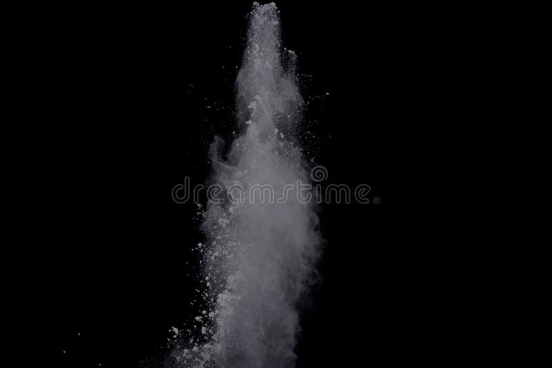 White powder explosion on black background. Dust splatted isolated. Paint Holi. White powder explosion on black background. Dust splatted isolated. Paint Holi.