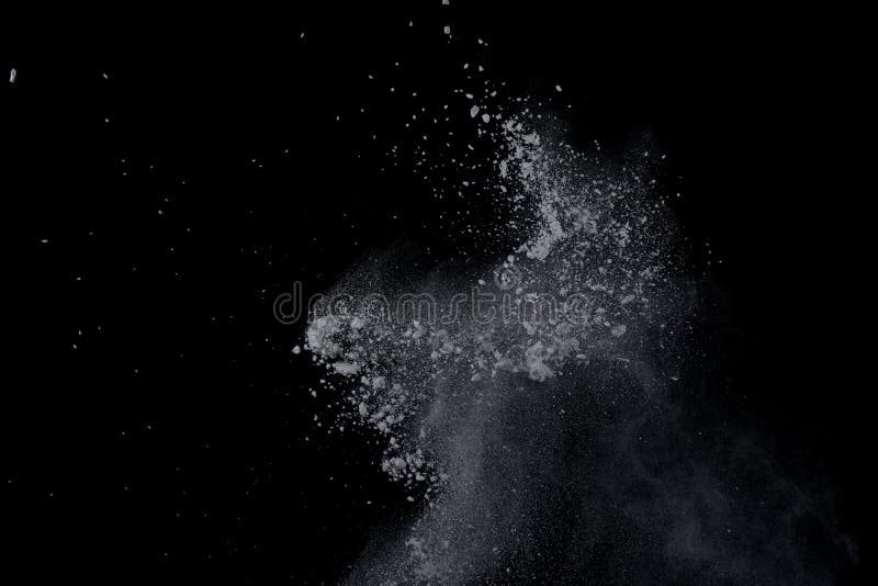 White powder explosion on black background. Dust splatted isolated. Paint Holi. White powder explosion on black background. Dust splatted isolated. Paint Holi.