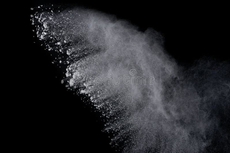 White powder explosion on black background. Dust splatted isolated. Paint Holi. White powder explosion on black background. Dust splatted isolated. Paint Holi.