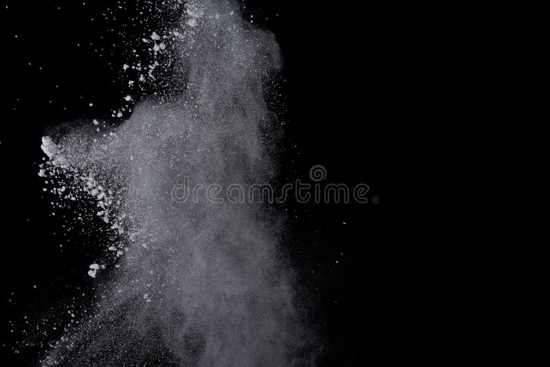 White powder explosion on black background. Dust splatted isolated. Paint Holi. White powder explosion on black background. Dust splatted isolated. Paint Holi.