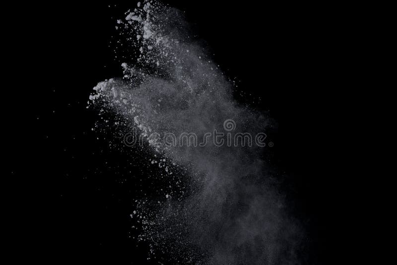 White powder explosion on black background. Dust splatted isolated. Paint Holi. White powder explosion on black background. Dust splatted isolated. Paint Holi.