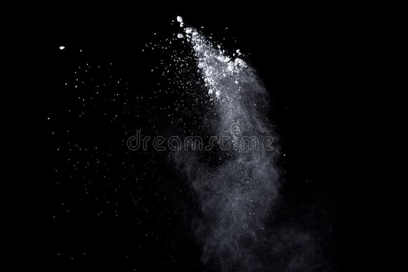 White powder explosion on black background. Dust splatted isolated. Paint Holi. White powder explosion on black background. Dust splatted isolated. Paint Holi.