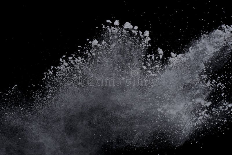 White powder explosion on black background. Dust splatted isolated. Paint Holi. White powder explosion on black background. Dust splatted isolated. Paint Holi.