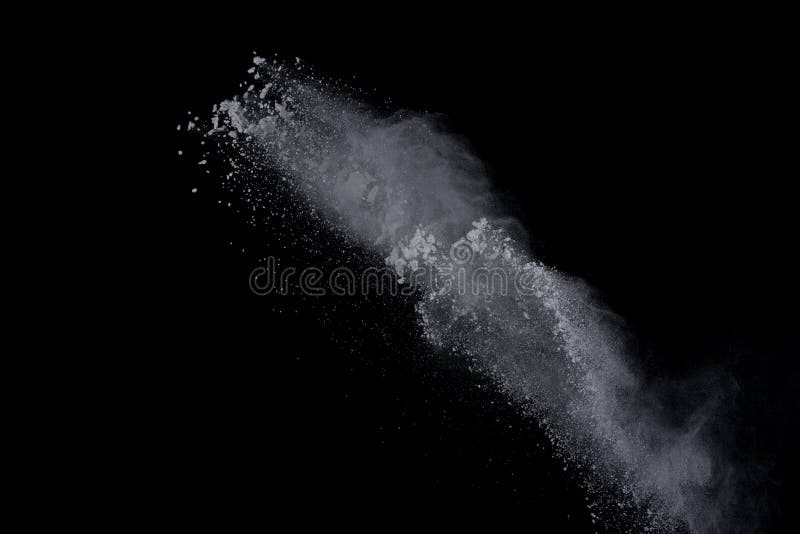 White powder explosion on black background. Dust splatted isolated. Paint Holi. White powder explosion on black background. Dust splatted isolated. Paint Holi.