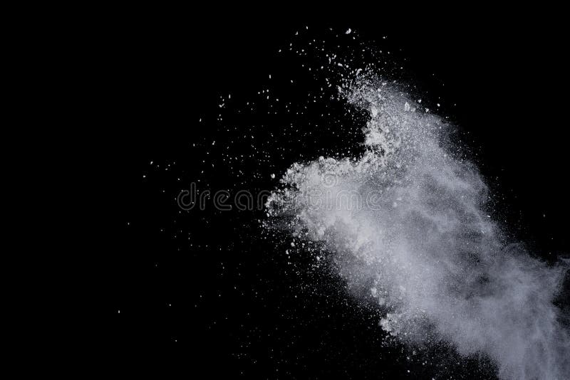 White powder explosion on black background. Dust splatted isolated. Paint Holi. White powder explosion on black background. Dust splatted isolated. Paint Holi.