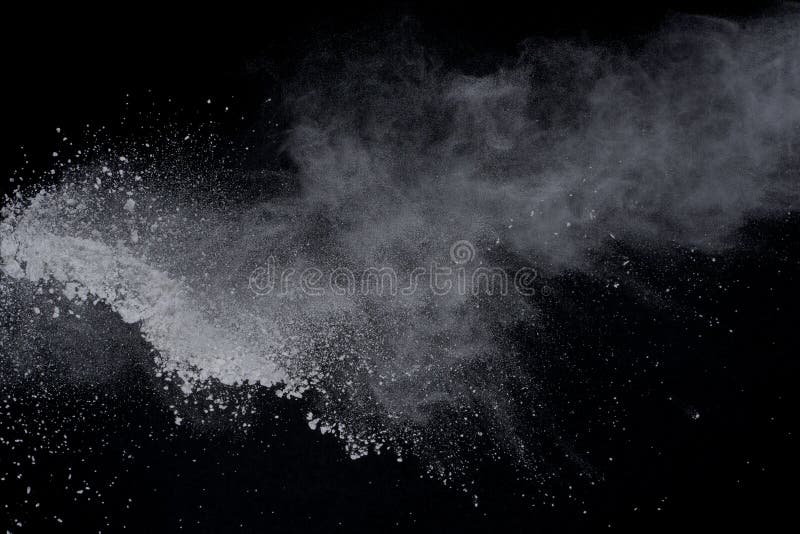 White powder explosion on black background. Dust splatted isolated. Paint Holi. White powder explosion on black background. Dust splatted isolated. Paint Holi.