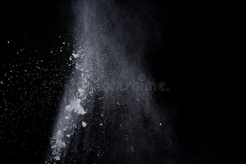 White powder explosion on black background. Dust splatted isolated. Paint Holi. White powder explosion on black background. Dust splatted isolated. Paint Holi.