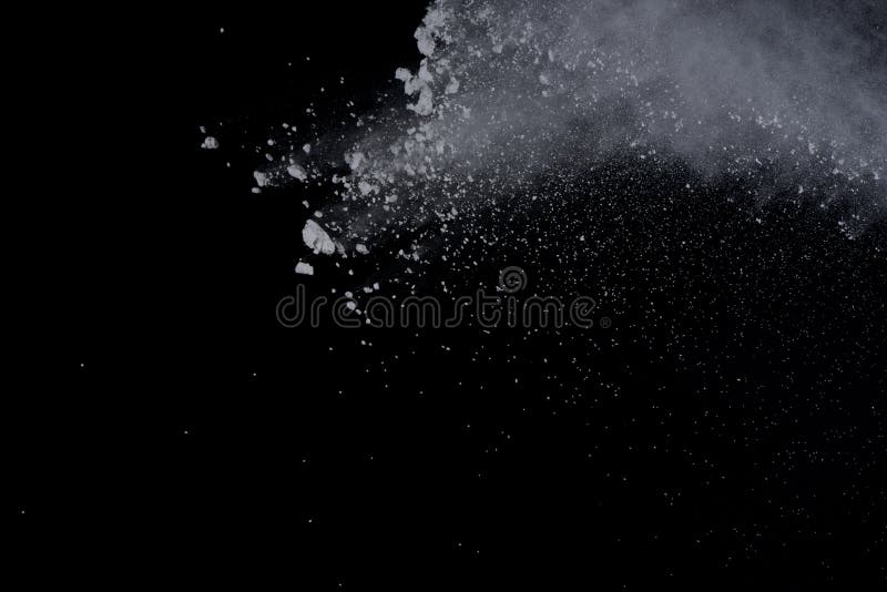 White powder explosion on black background. Dust splatted isolated. Paint Holi. White powder explosion on black background. Dust splatted isolated. Paint Holi.