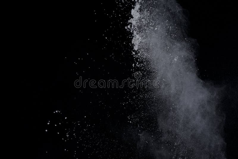 White powder explosion on black background. Dust splatted isolated. Paint Holi. White powder explosion on black background. Dust splatted isolated. Paint Holi.