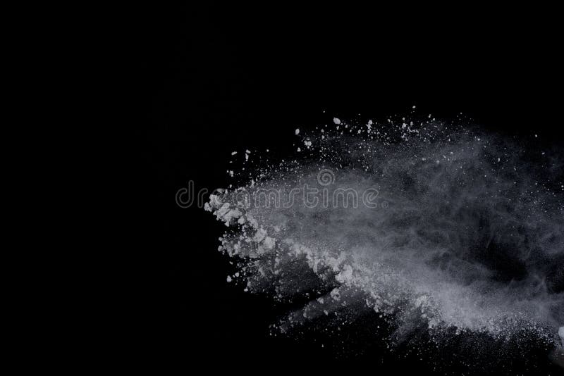 White powder explosion on black background. Dust splatted isolated. Paint Holi. White powder explosion on black background. Dust splatted isolated. Paint Holi.