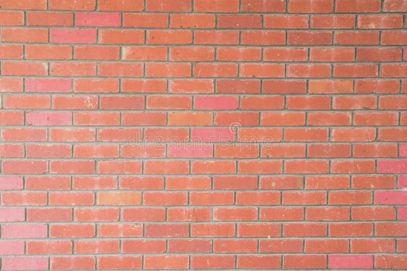 Exposed Red Brick Wall Texture As Background and Design Element Stock
