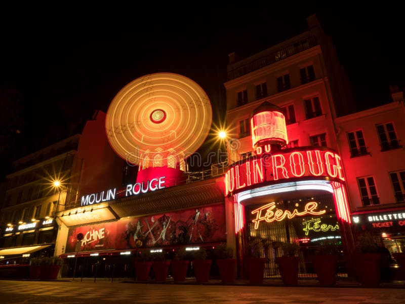 Night long exposure panorama view of Moulin Rouge concerts club entertainment cabaret Pigalle Montmartre Paris, France Europe. Night long exposure panorama view of Moulin Rouge concerts club entertainment cabaret Pigalle Montmartre Paris, France Europe