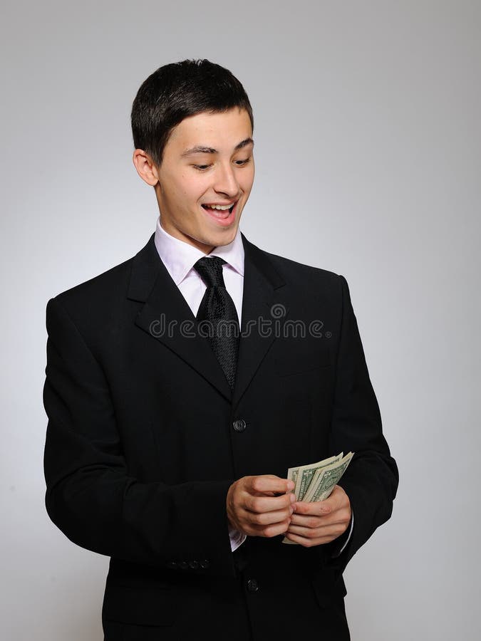 Expressions.Young handsome business man with money