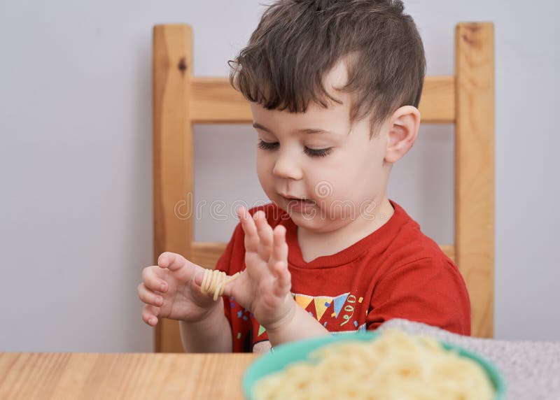 Expressive Boy is Playing with His Food at Lunch Stock Photo Image of