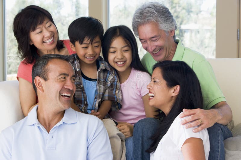 Extended family in living room smiling to eachother