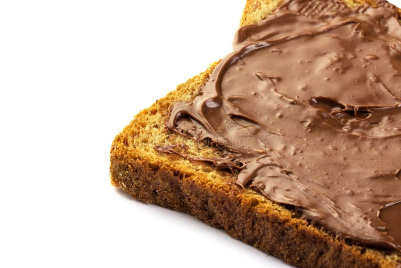 Chocolate hazelnut spread on whole wheat toast isolated detailed studio shot. Chocolate hazelnut spread on whole wheat toast isolated detailed studio shot.