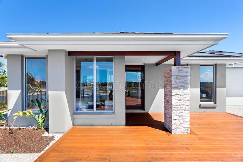 Exterior of a modern house with a wooden floor with blue sky royalty free stock image Exterior of a modern house with a wooden floor with blue sky royalty free stock image