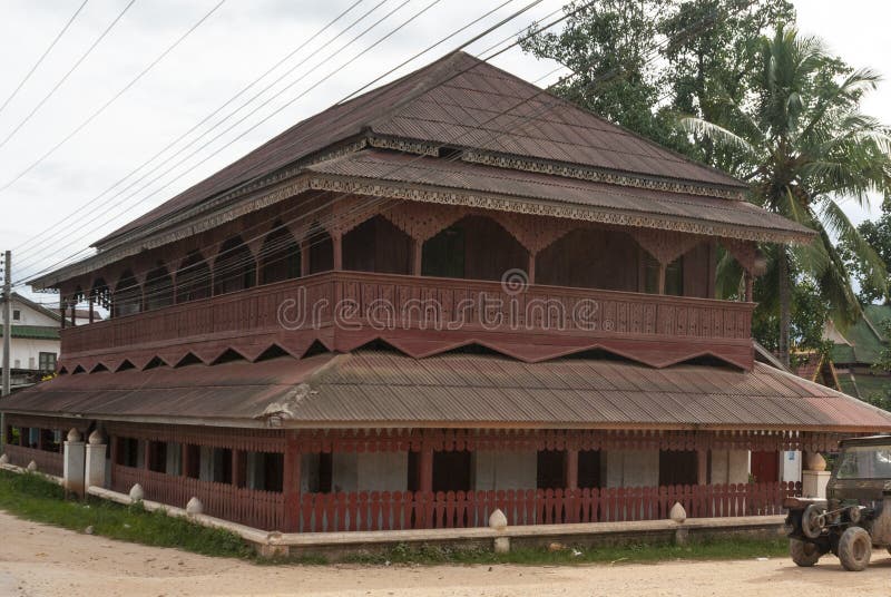 Exterior of an old wooden building in Muang Sing village, Luang Nam Tha province, Laos