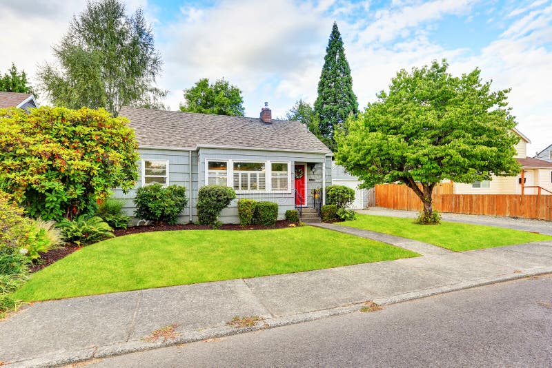 Exterior of small American house with blue paint. Northwest, USA