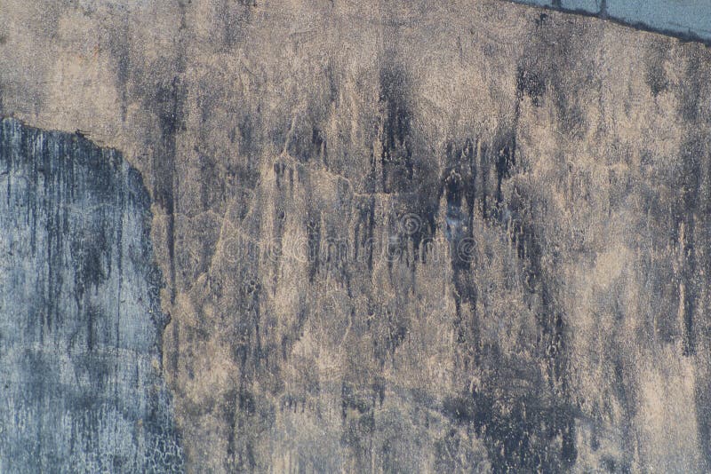 The exterior wall of the house is smeared with dark streaks. The consequences of the interaction of rain, dust royalty free stock image