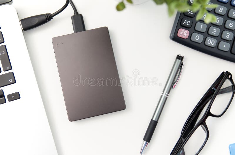 External backup disk hard drive connected to laptop