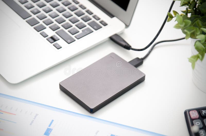 External backup disk hard drive connected to laptop