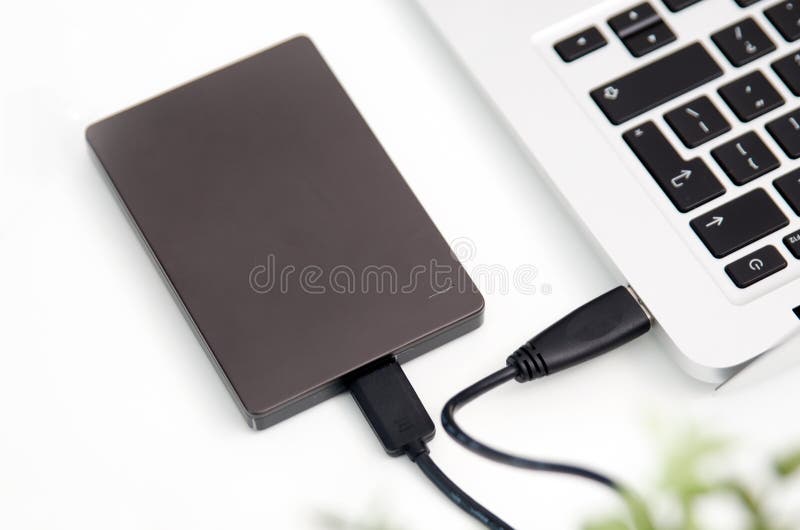 External backup disk hard drive connected to laptop