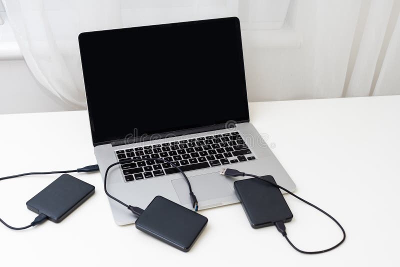 External backup disk hard drive connected to laptop