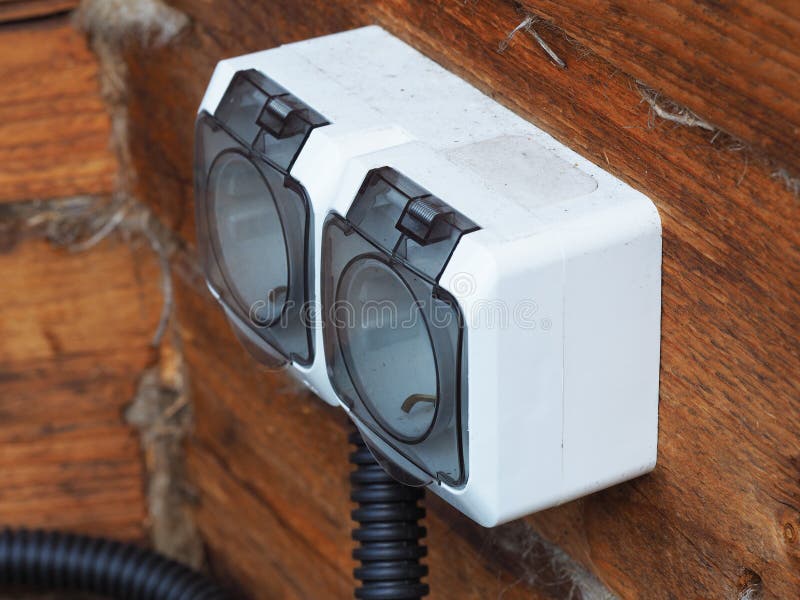 External Electrical Outlet on the Wooden Wall of the House. Stock Image
