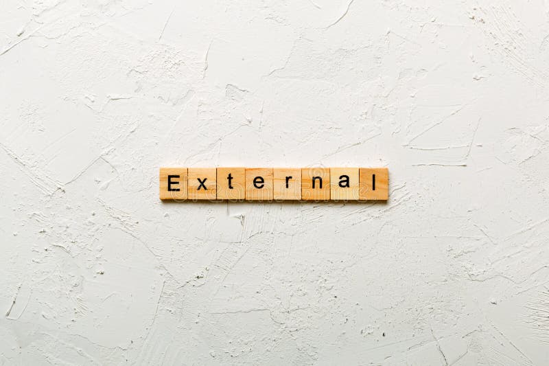 EXTERNAL word written on wood block. EXTERNAL text on cement table for your desing, concept. Alphabet project stock images, royalty-free photos and pictures