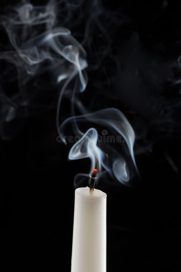 Extinguished candle with smoke