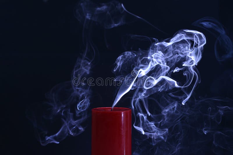 Extinguished Candle with Smoke Trailing Off the Wick Stock Image