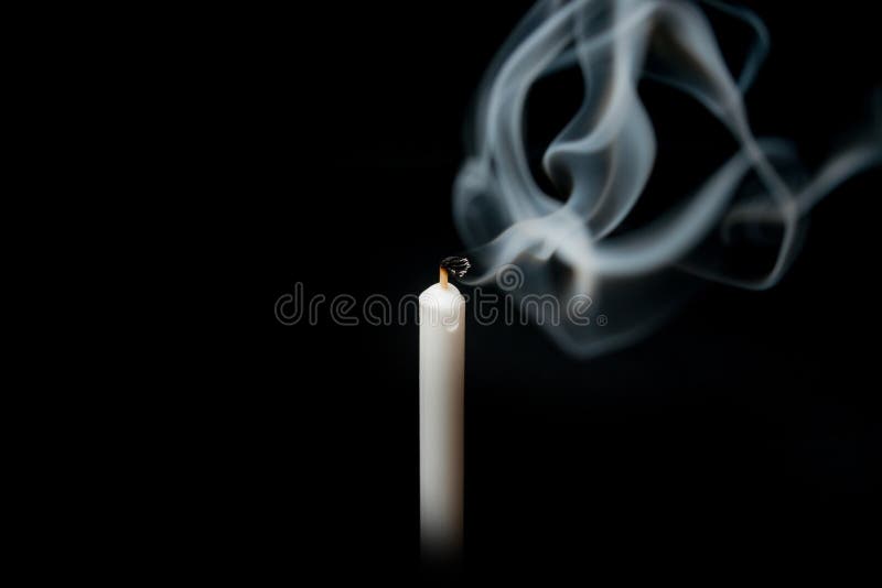 Extinguished candle white with smoke, isolated over black stock photo Extinguished candle white with smoke, isolated over black stock photo