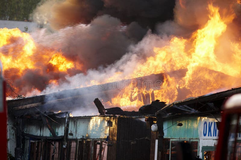 Extinguishing big fire stock photos